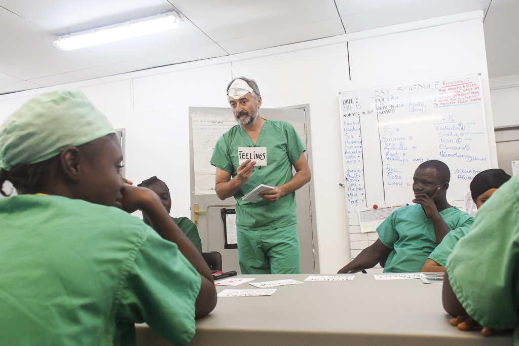 In the middle, José, the psychologist in charge of the psychosocial team, is speaking with the nurses during a training for the admission of children alone. The Ebola protective clothing meant a big barrier in the relation with patients and their tranquility. In the case of children, reduce their fear and relax them was not an easy goal, specially having into account the conditions of these kids at the time of arrive at the hospital. Ebola Treatment Center. Moyamba. Sierra Leone.